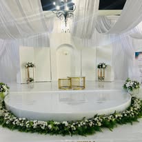 Round wedding stage with floral arch