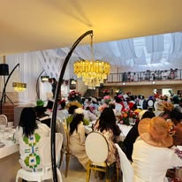 Wide view of guests dining under elegant lighting