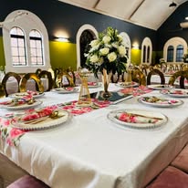 Floral table setting in a church hall