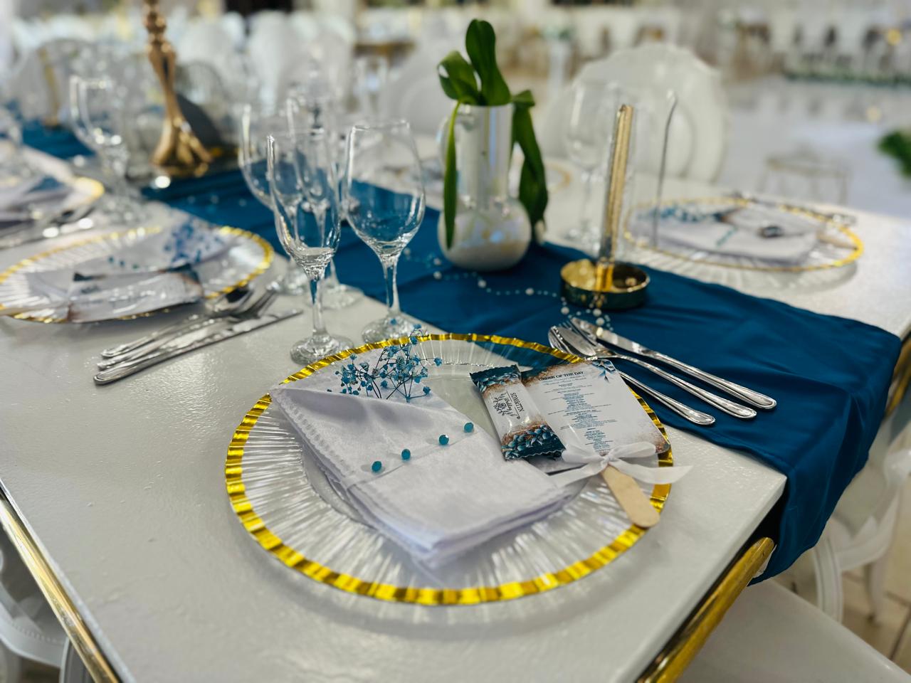 Blue and gold place setting with menu card