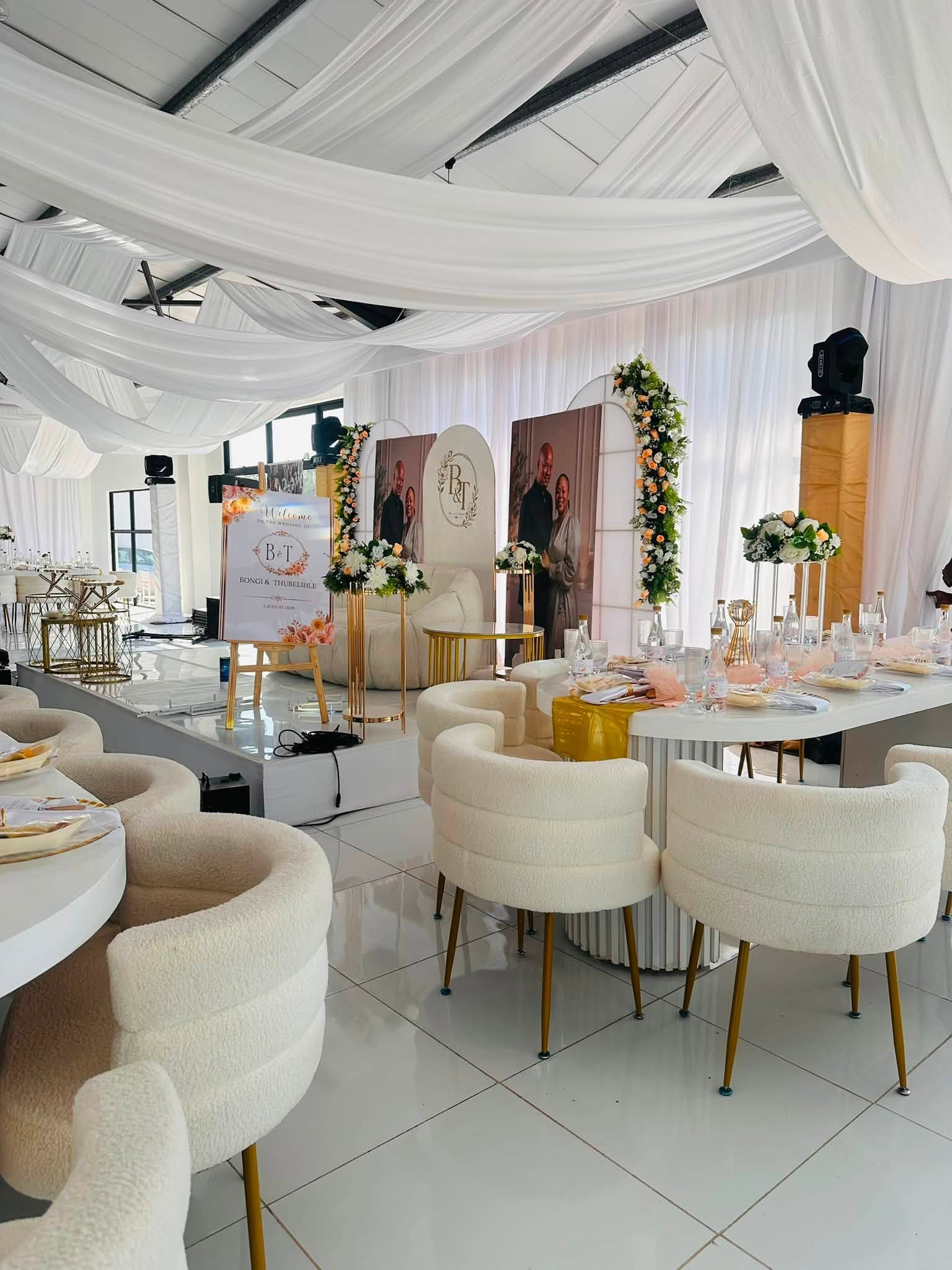 Wedding stage with couple portraits
